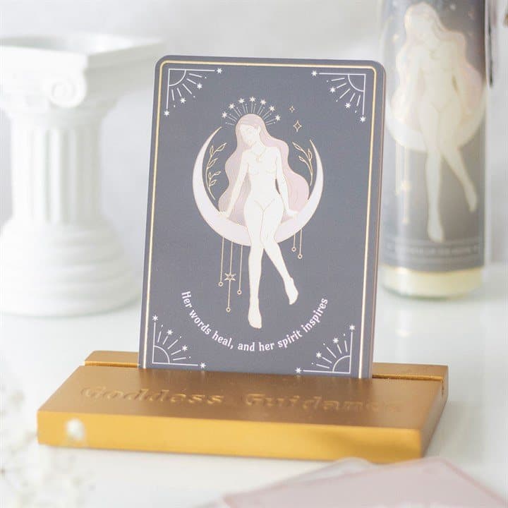 Goddess affirmation cards displayed on a matching wooden stand