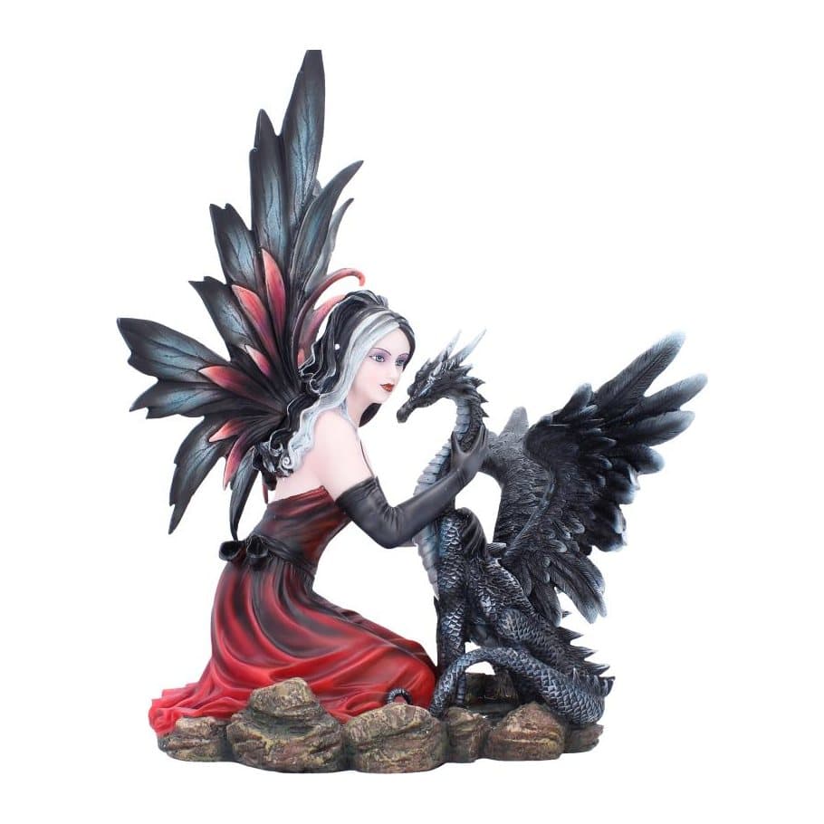 Gothic fairy in black and red kneeling beside a black dragon figurine