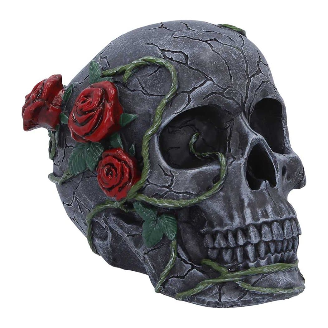 Black skull figurine decorated with red roses and vines