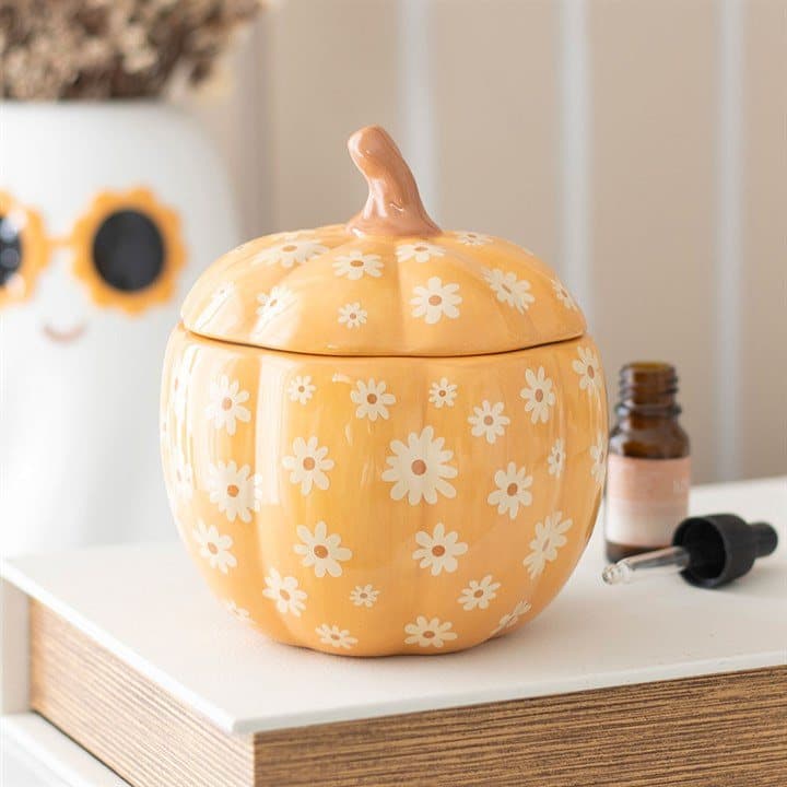Orange pumpkin shaped ceramic oil burner with floral pattern