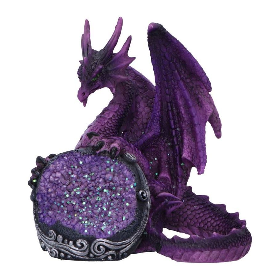 Purple dragon figurine with green eyes holding a black orb with purple geode crystals