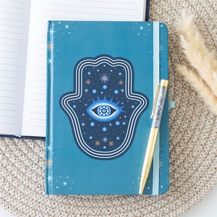 Turquoise A5 notebook with dark blue hamsa design and a gold-tone crystal chip pen
