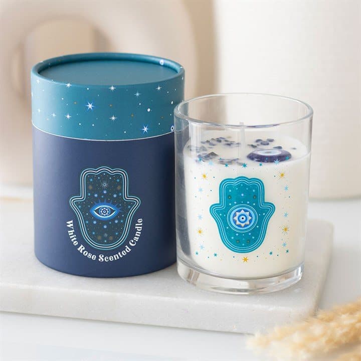Glass jar candle with a Hand of Hamsa design and star accents