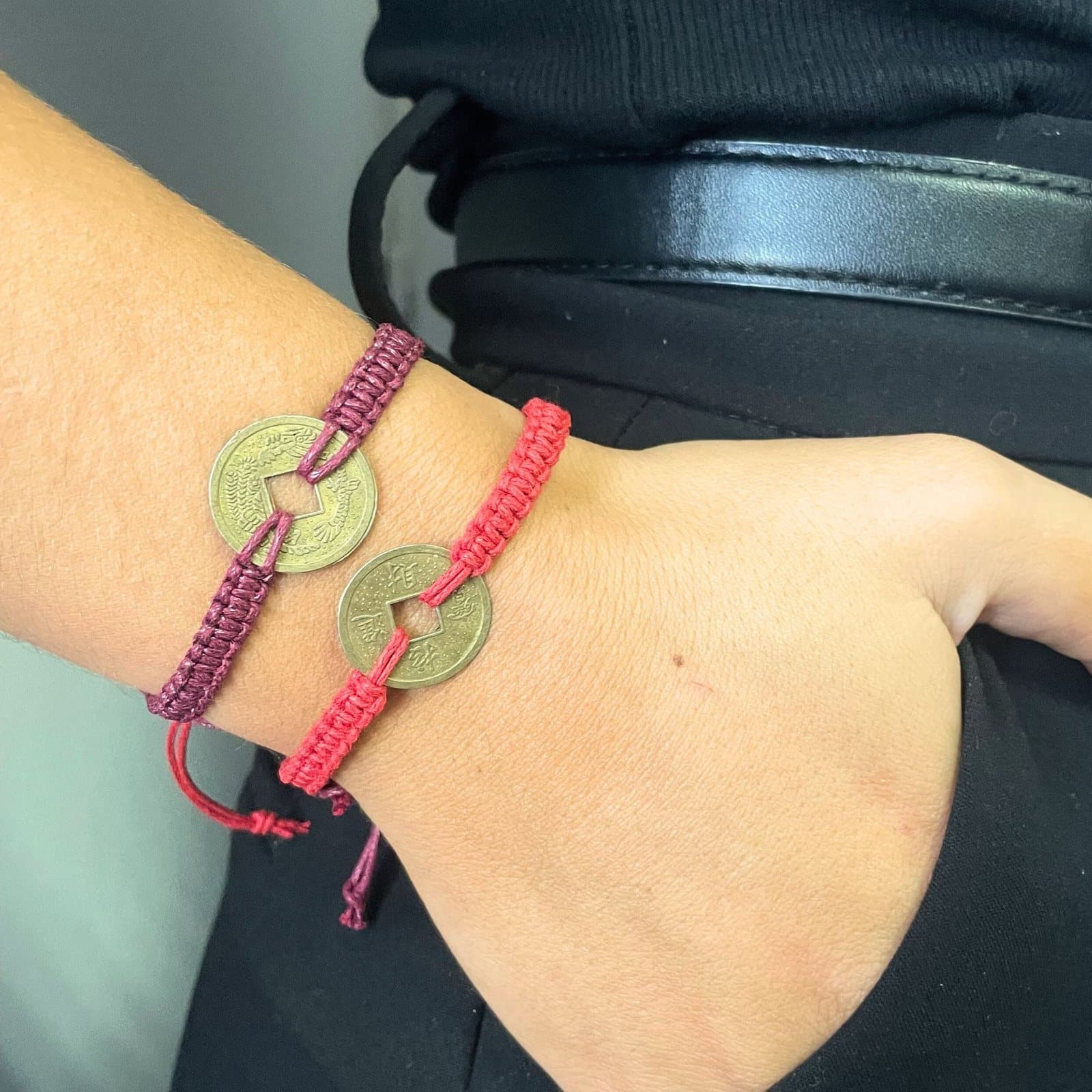 Handmade raffia friendship bracelets with a Feng Shui coin theme