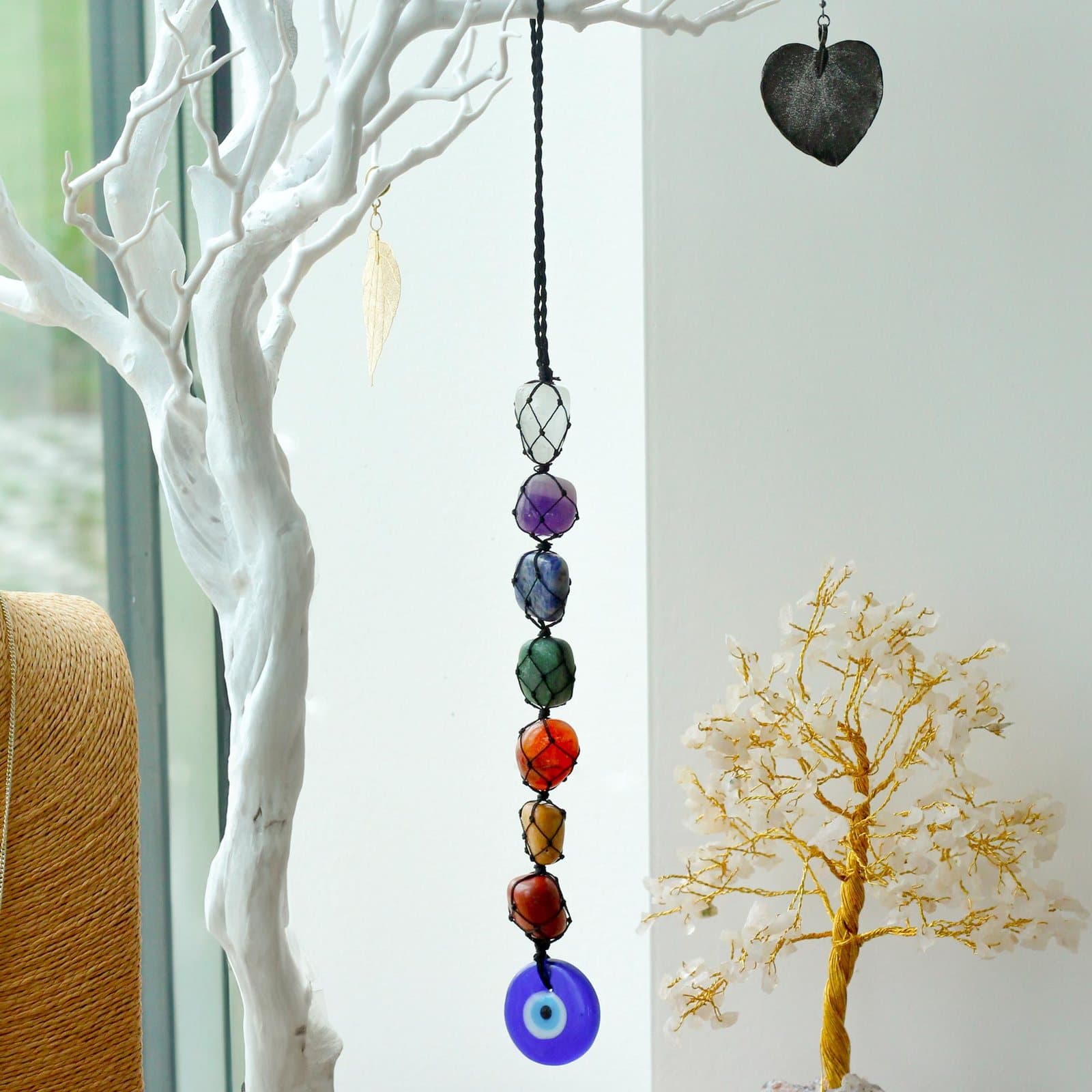 Hanging chakra stone pendant with an evil eye