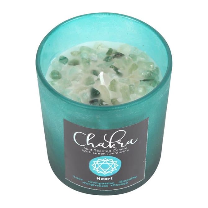 Mint candle in green frosted glass with a metallic lid and green aventurine chips