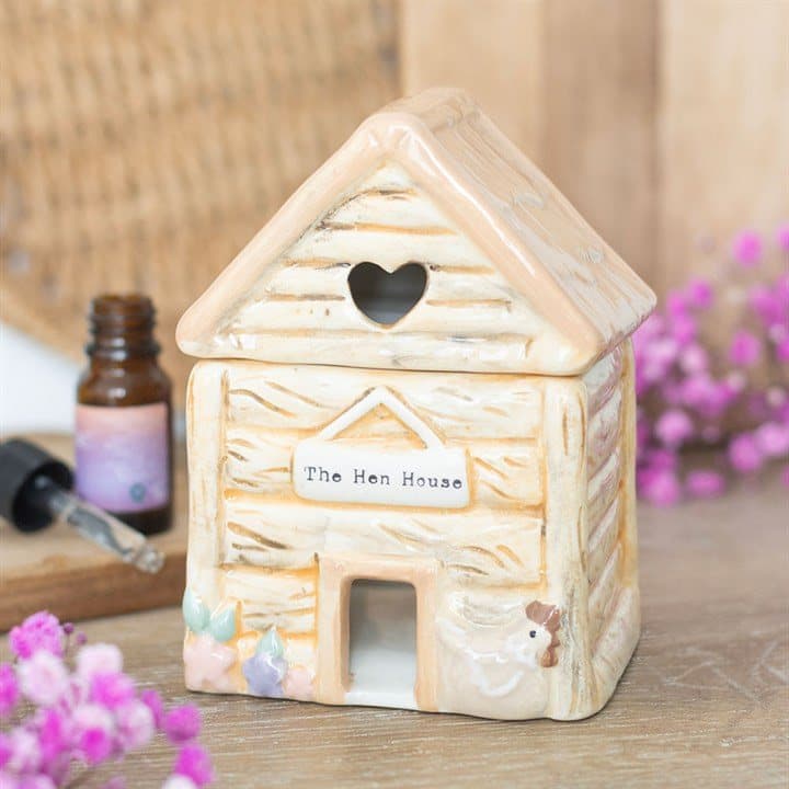 Ceramic hen house oil burner with heart-shaped cut-out and sign