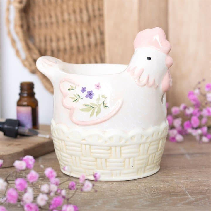 Pastel ceramic hen shaped oil burner with floral detailing