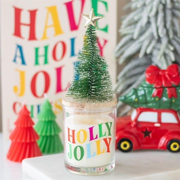 Holly Jolly pine and fir glass candle with wooden lid and small Christmas tree