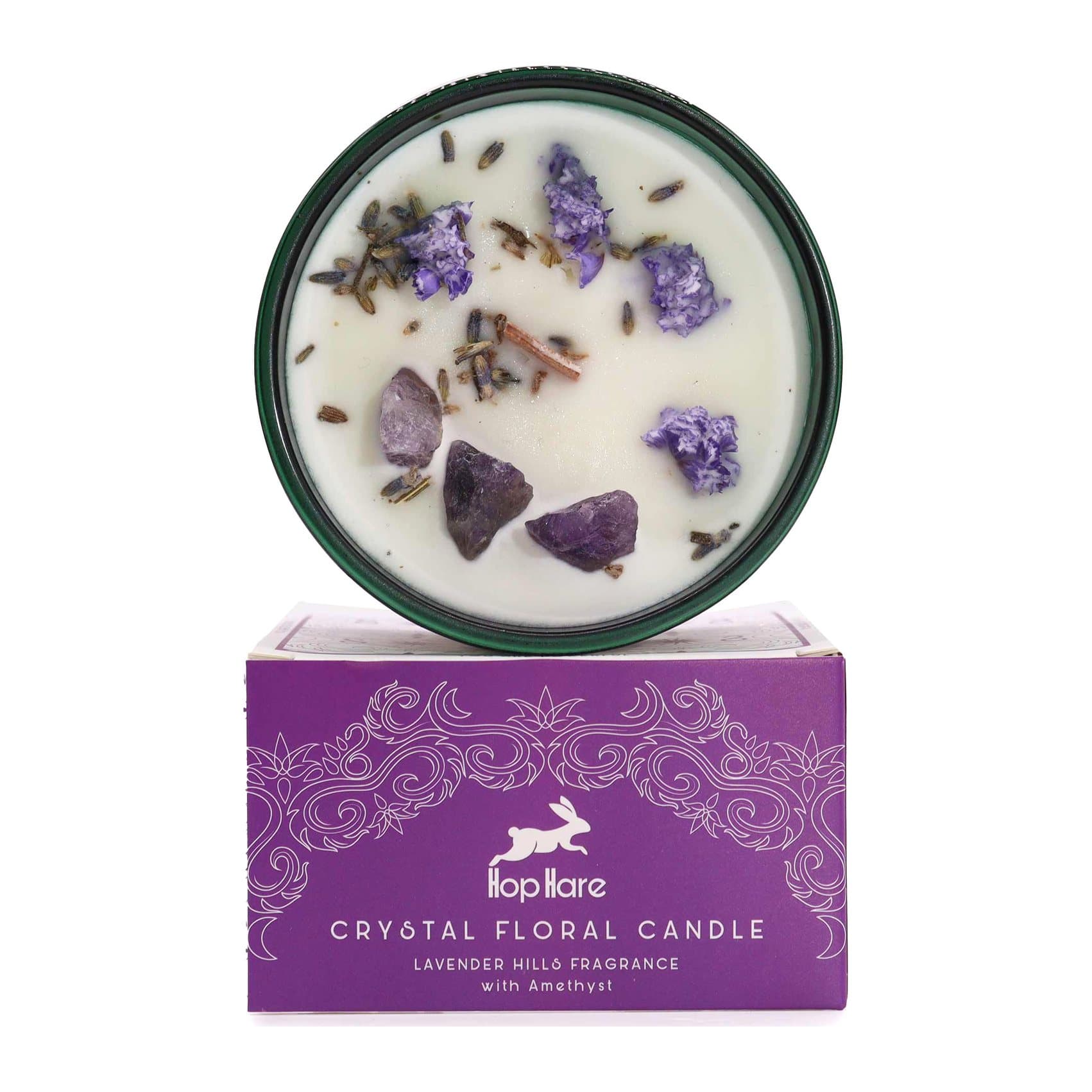 Soy wax candle topped with purple amethyst pieces and lavender flowers, with a tarot card