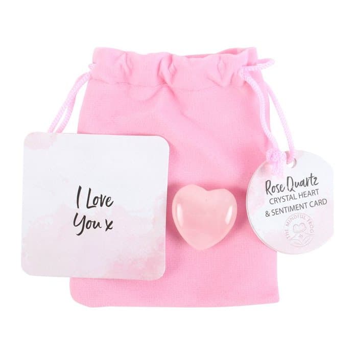 Rose quartz crystal heart with a pink velvet drawstring bag