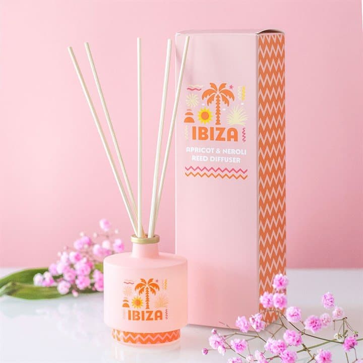 Ibiza Sunrise apricot and neroli reed diffuser in a colour cardboard box with a window