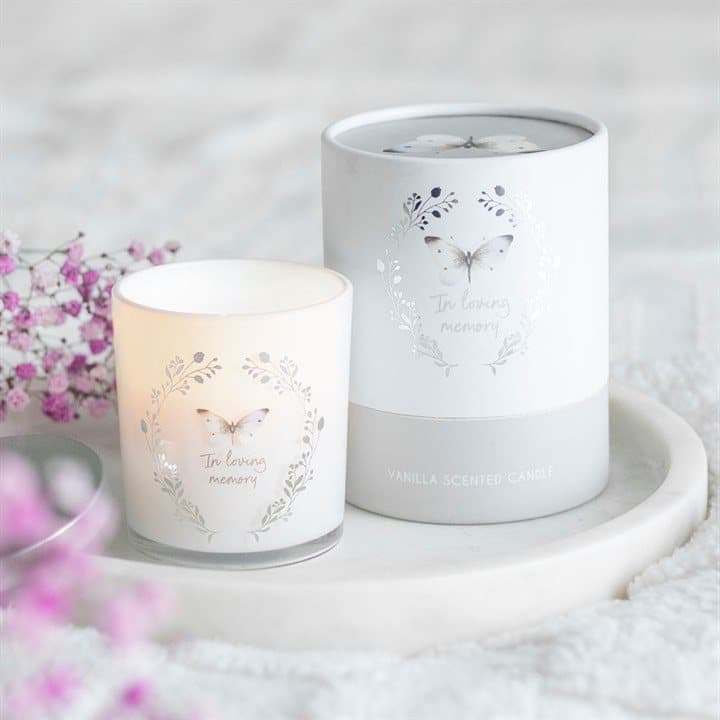 White butterfly vanilla candle with the words In loving memory