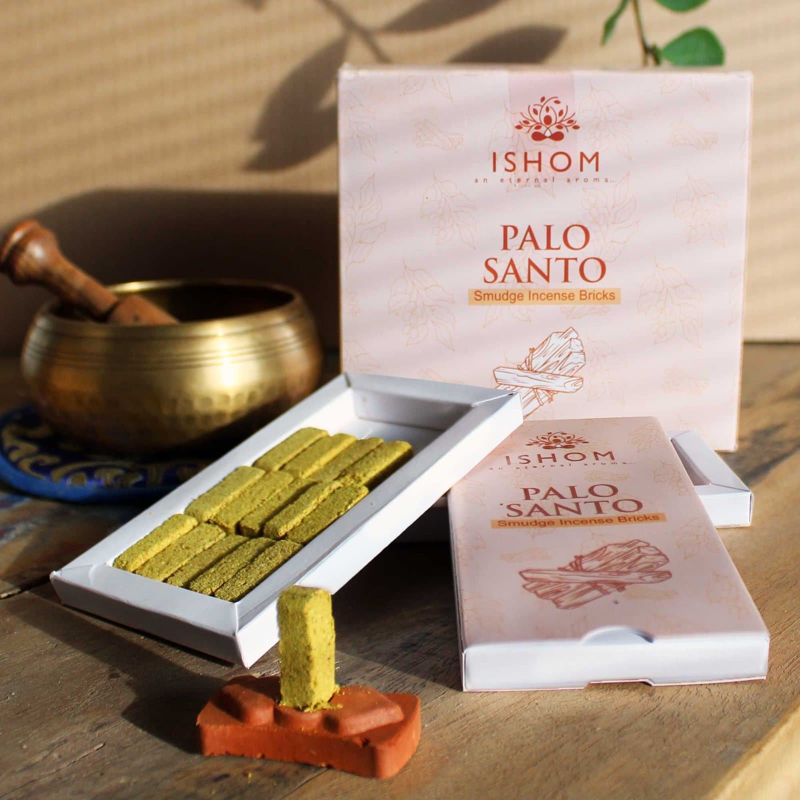 Palo santo incense bricks with a terracotta holder
