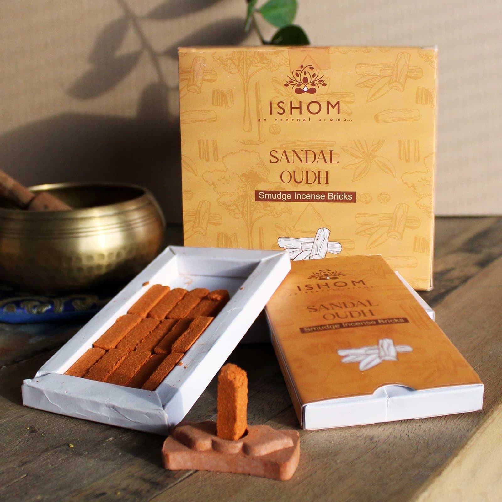 Sandalwood incense bricks with a terracotta holder