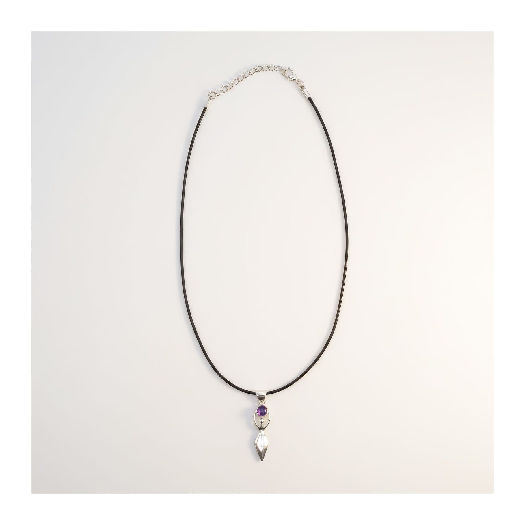 Silver-plated goddess pendant with a purple stone on a black cord