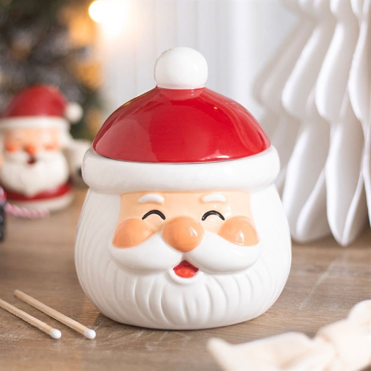 Ceramic oil burner and wax warmer shaped like a jolly Santa Claus