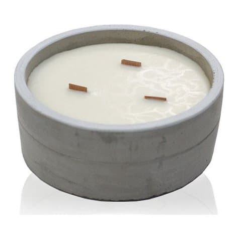 Wooden wick candle in a raw concrete pot