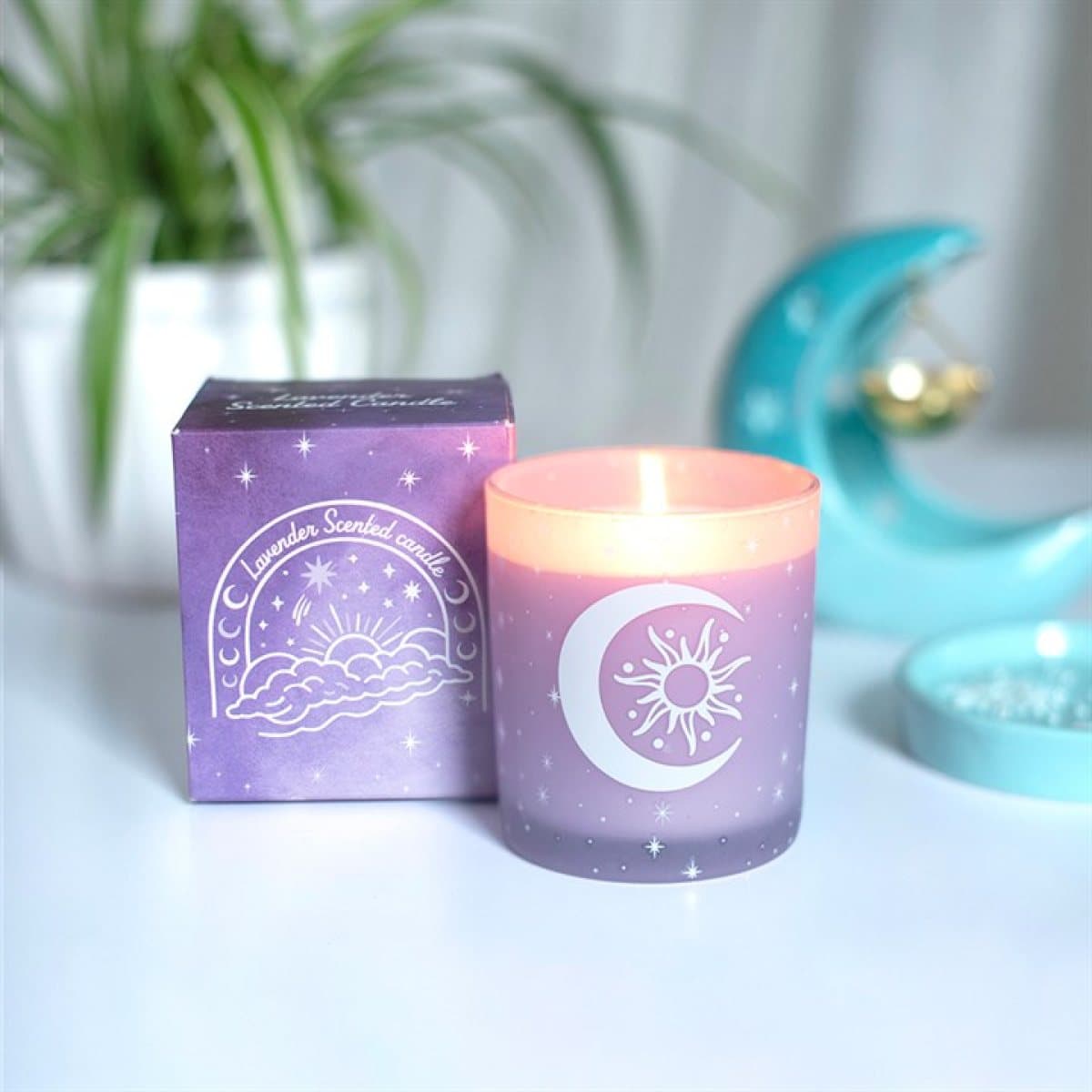 Purple frosted glass lavender candle with a white moon motif