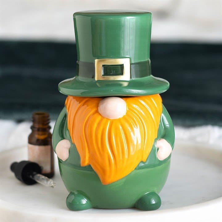 Ceramic oil burner shaped like a bearded leprechaun gonk in green with a tall hat