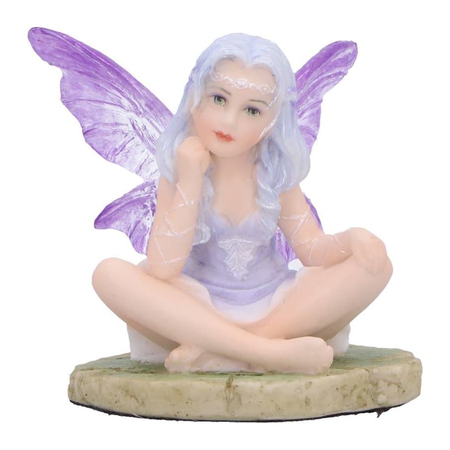 Lila lavender fairy figurine seated on a rocky path with purple gown and wings