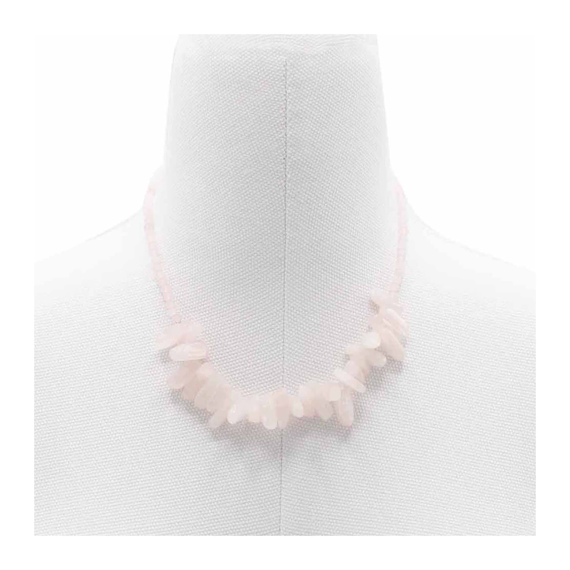 Necklace of long pink rose quartz stones with small round gemstones