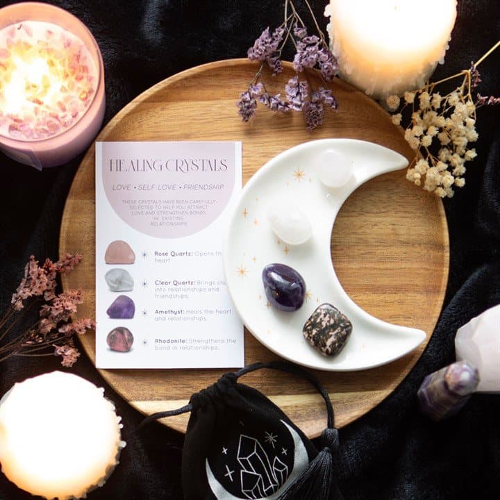 Four tumble stones with a crescent moon trinket dish
