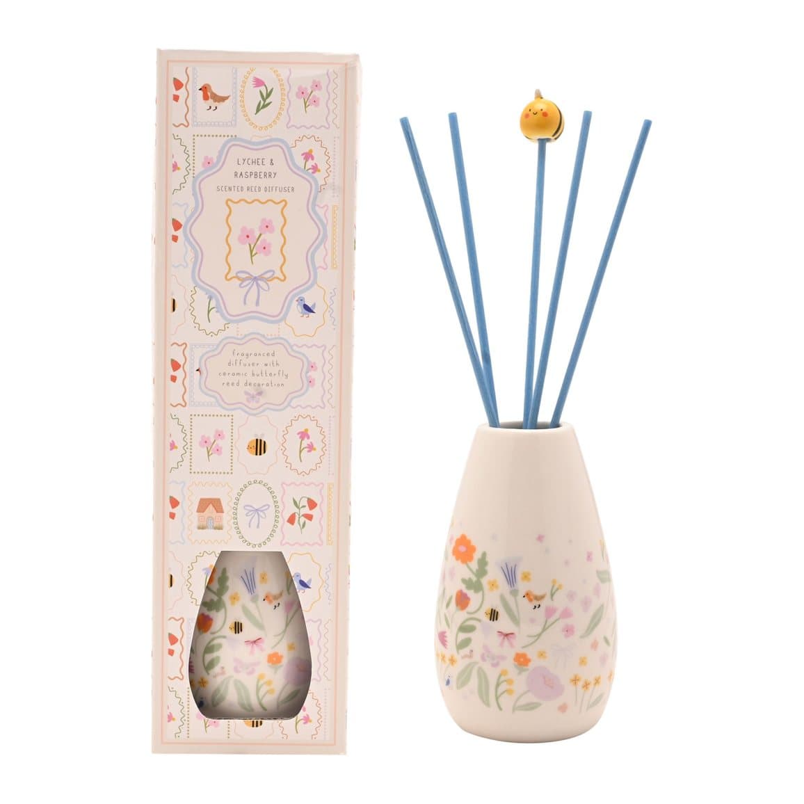 Decorative ceramic reed diffuser vessel with reeds and soft florals