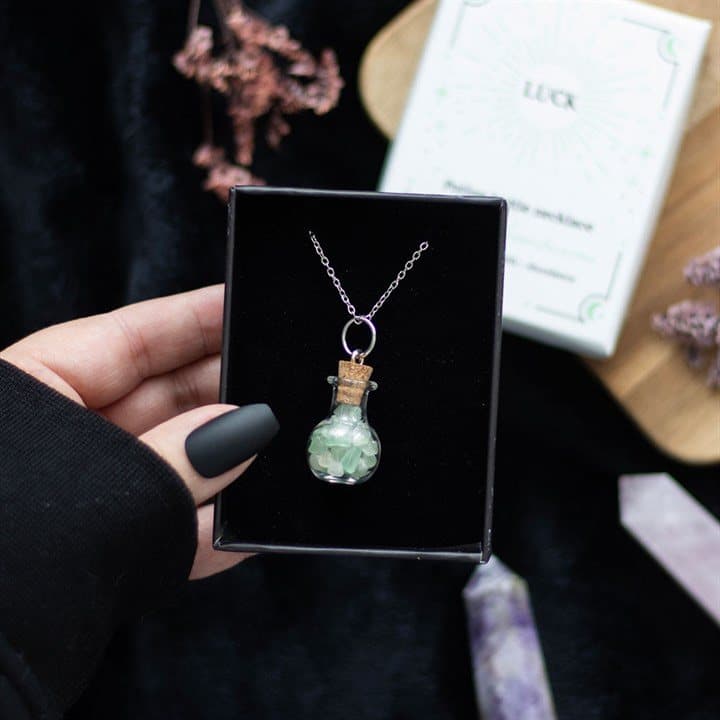 Miniature potion bottle necklace filled with green aventurine chips