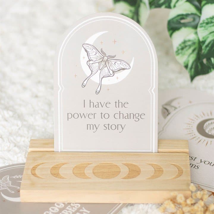 Luna moth and crescent moon affirmation cards on a wooden stand