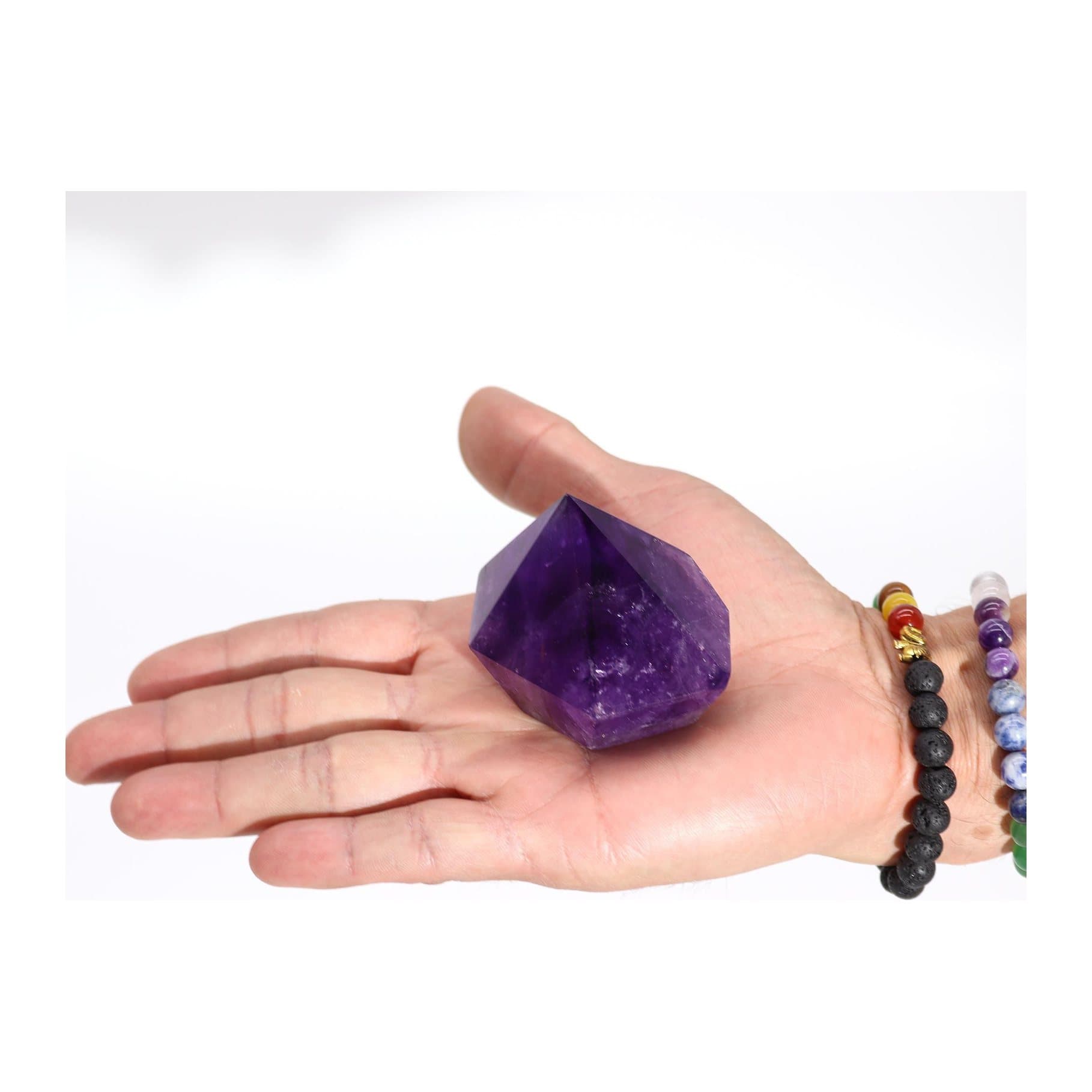 A medium polished purple amethyst crystal point
