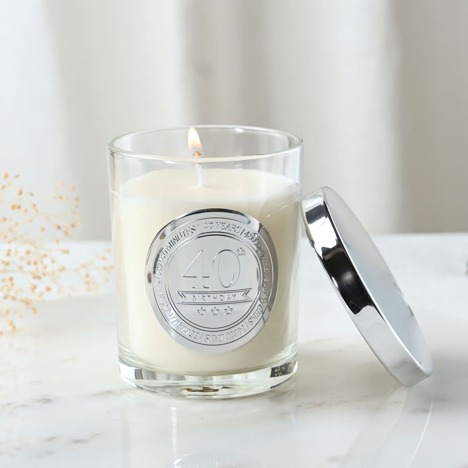 Sandalwood candle in glass with a metallic-effect embossed 40 seal and lid