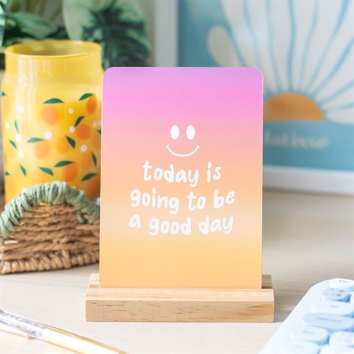 Ten brightly coloured affirmation cards with a wooden display stand