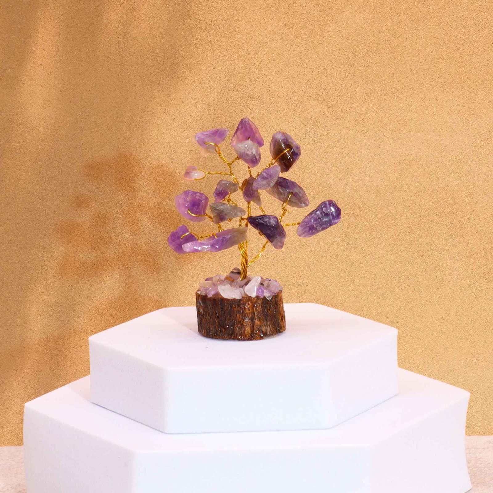 Mini amethyst gemstone tree on a wood base