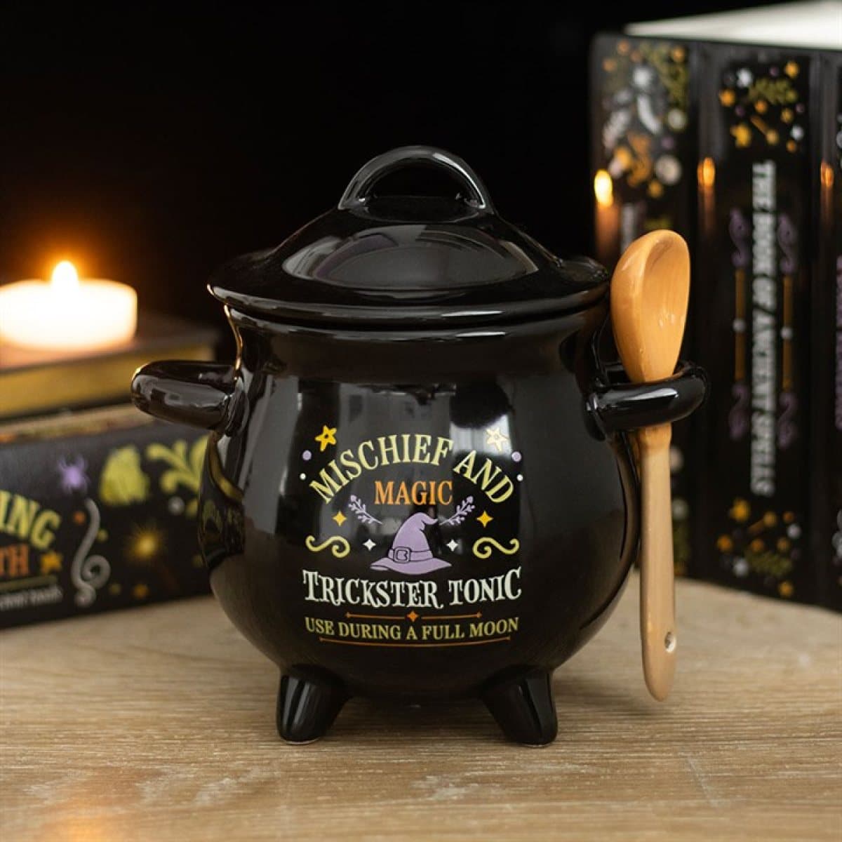 Ceramic cauldron soup bowl with a broom-shaped spoon in the handle