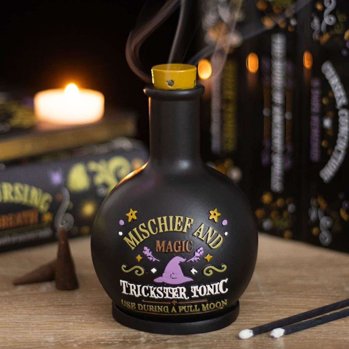 Potion bottle incense cone holder with Mischief and Magic Trickster Tonic wording