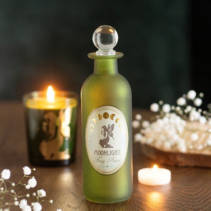 Green glass potion bottle with a crystal-style stopper and Moonlight Fairy label