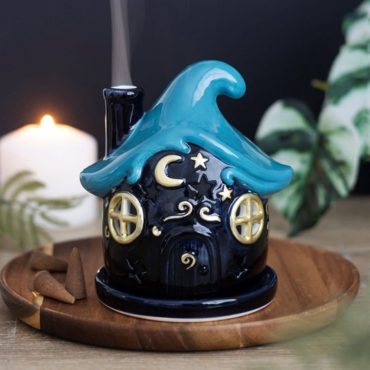 Ceramic cottage incense cone holder with blue wave roof and gold moons