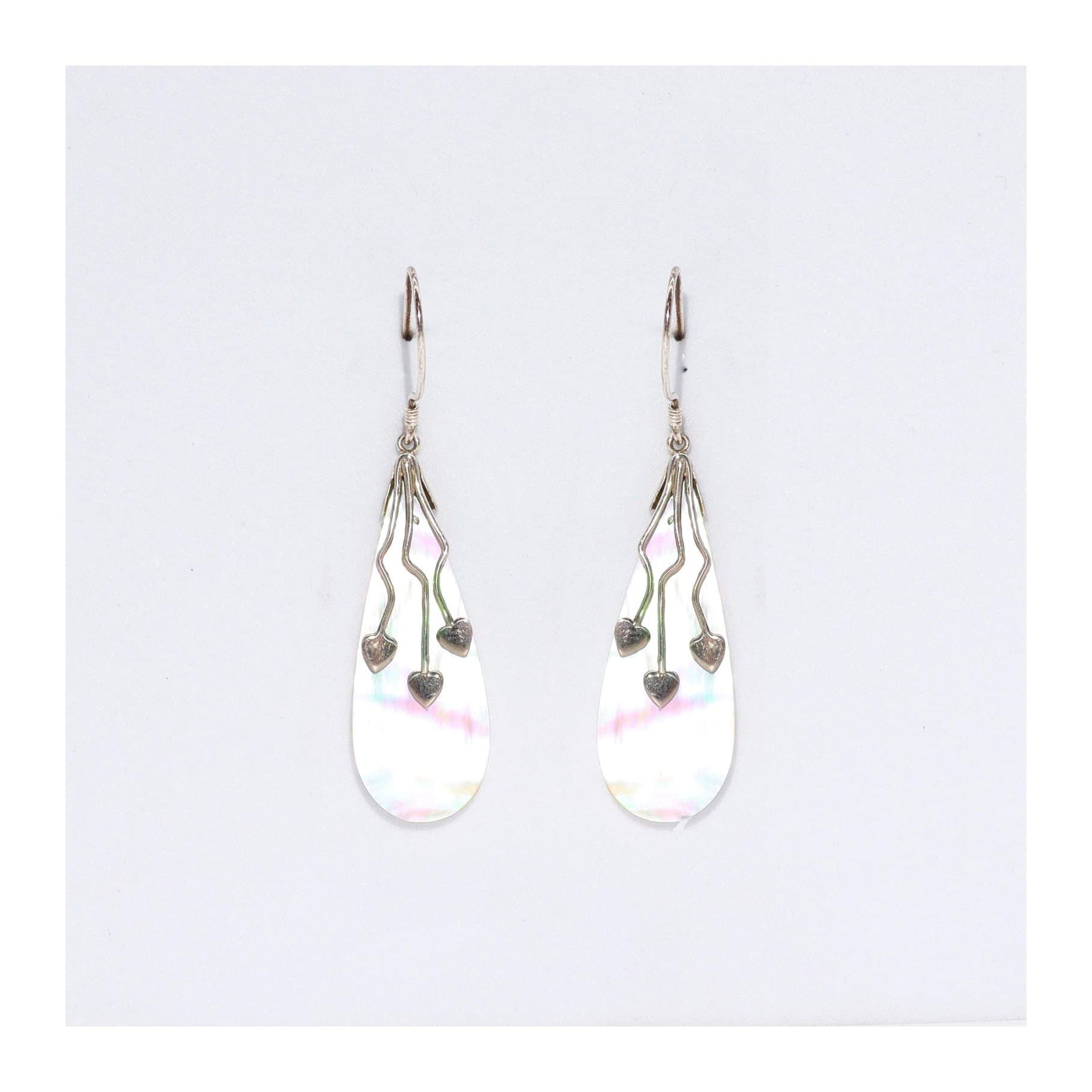 Pair of shell and silver earrings with a three hearts design