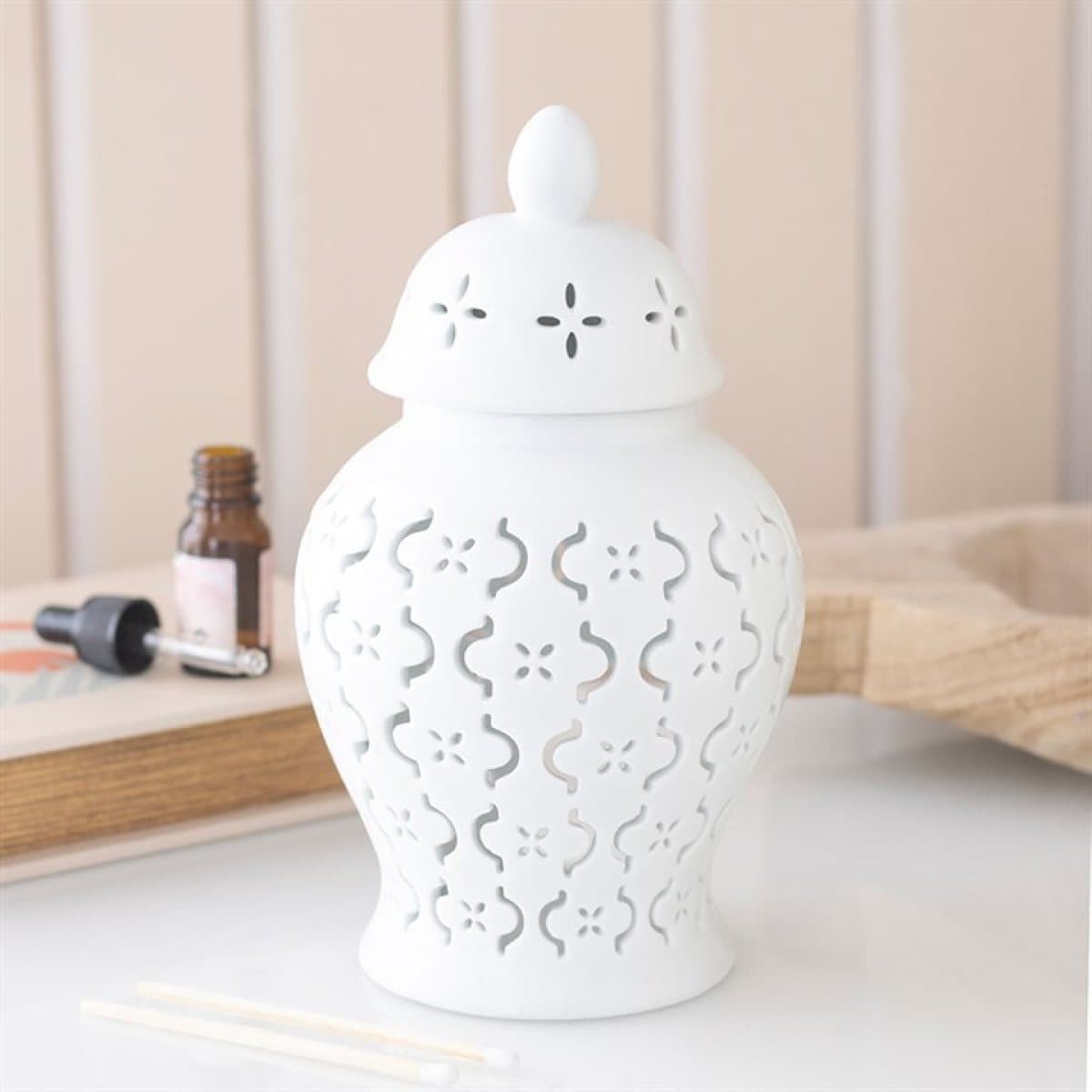 White ceramic Moroccan lantern oil burner with cut-out design