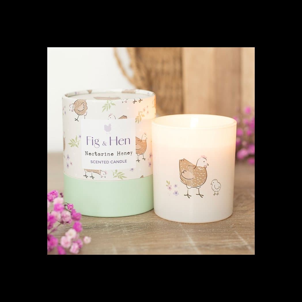 Nectarine honey candle in a cream glass holder with a hen and chick design