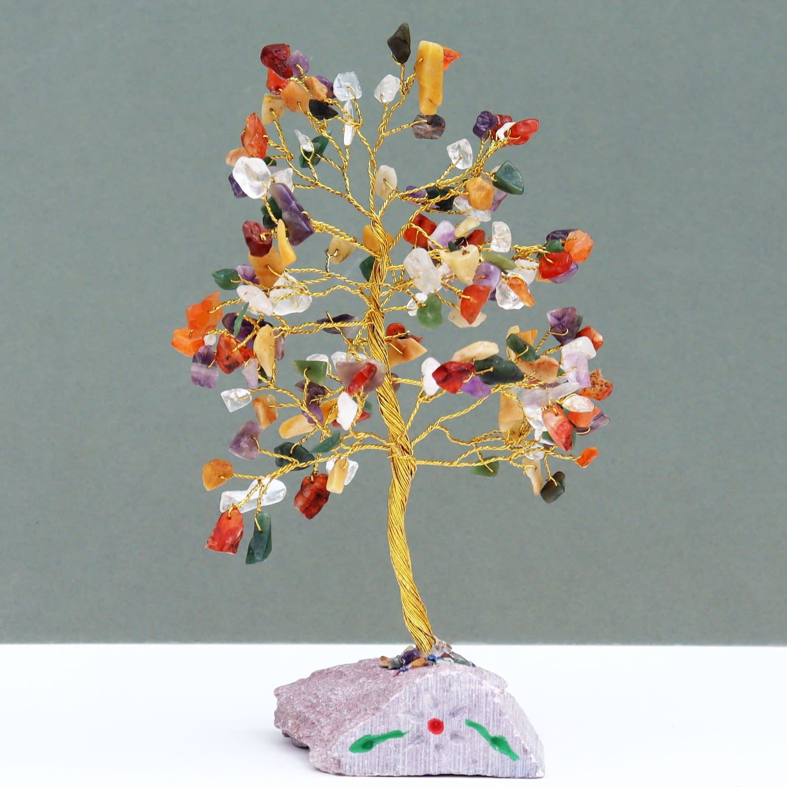 Handmade gemstone tree with branches on a gemstone rock base