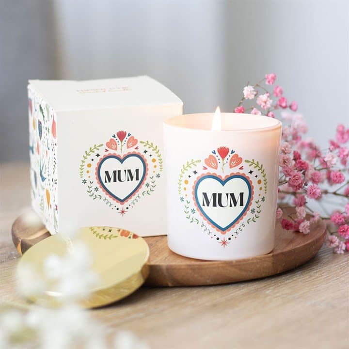 Soft cream jar candle with a heartfelt folk design
