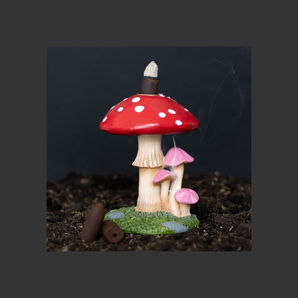 Mushroom backflow incense burner with a large toadstool and smaller mushrooms