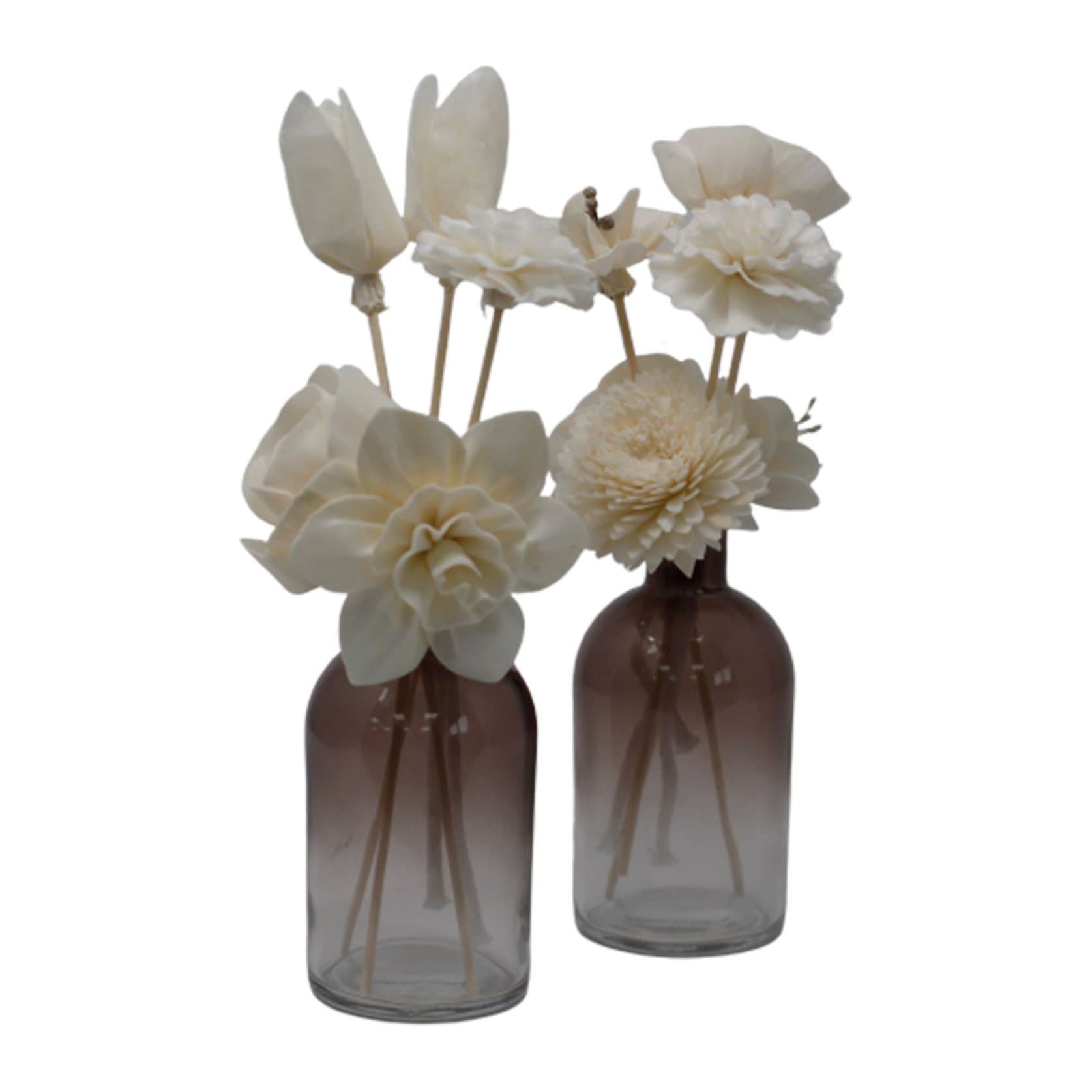 Four cream sola wood flowers on reeds for a fragrance oil diffuser