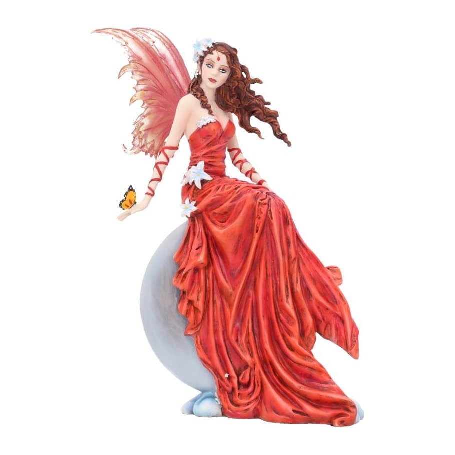 Fairy figurine in a red dress sitting on a full moon with a butterfly