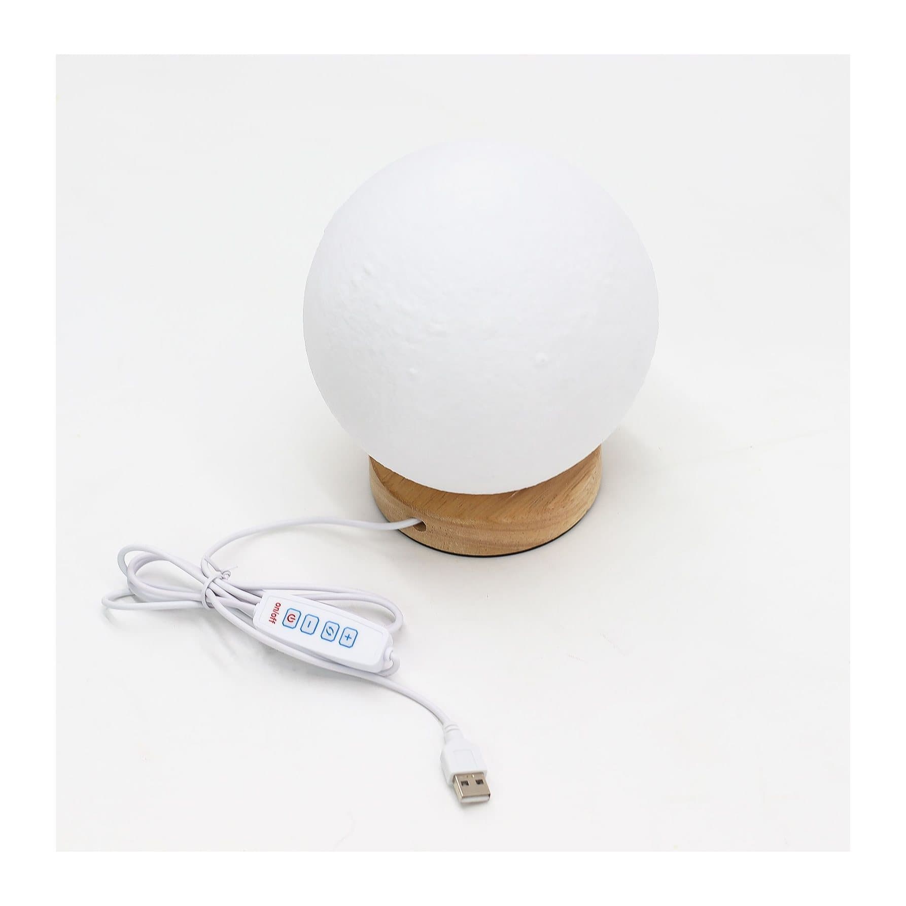 Moon lamp with a cratered surface on a wooden base