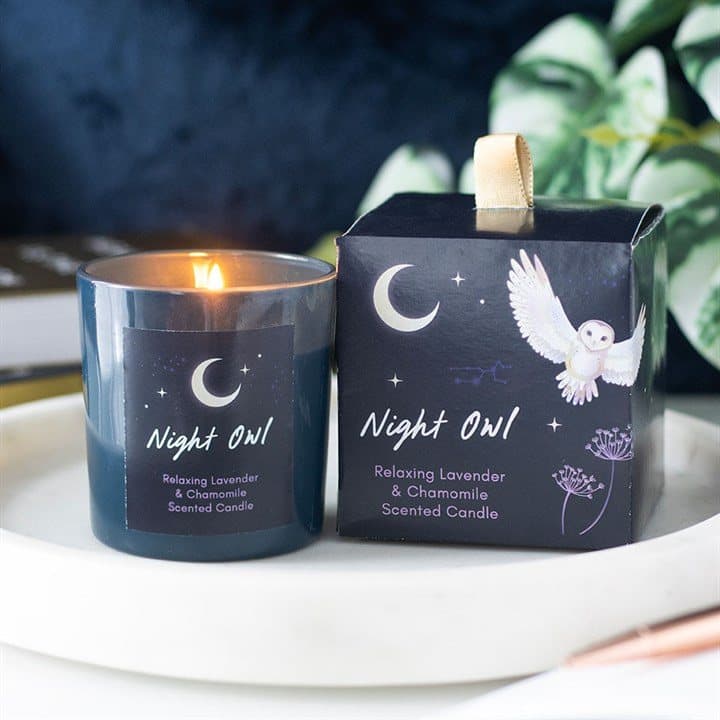 Night Owl scented candle in a glass holder with a gold-tone metal lid