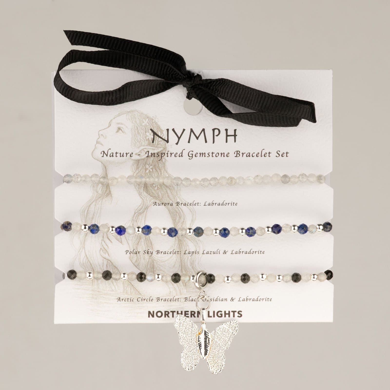Three gemstone bracelets presented on an illustrated Nymph card