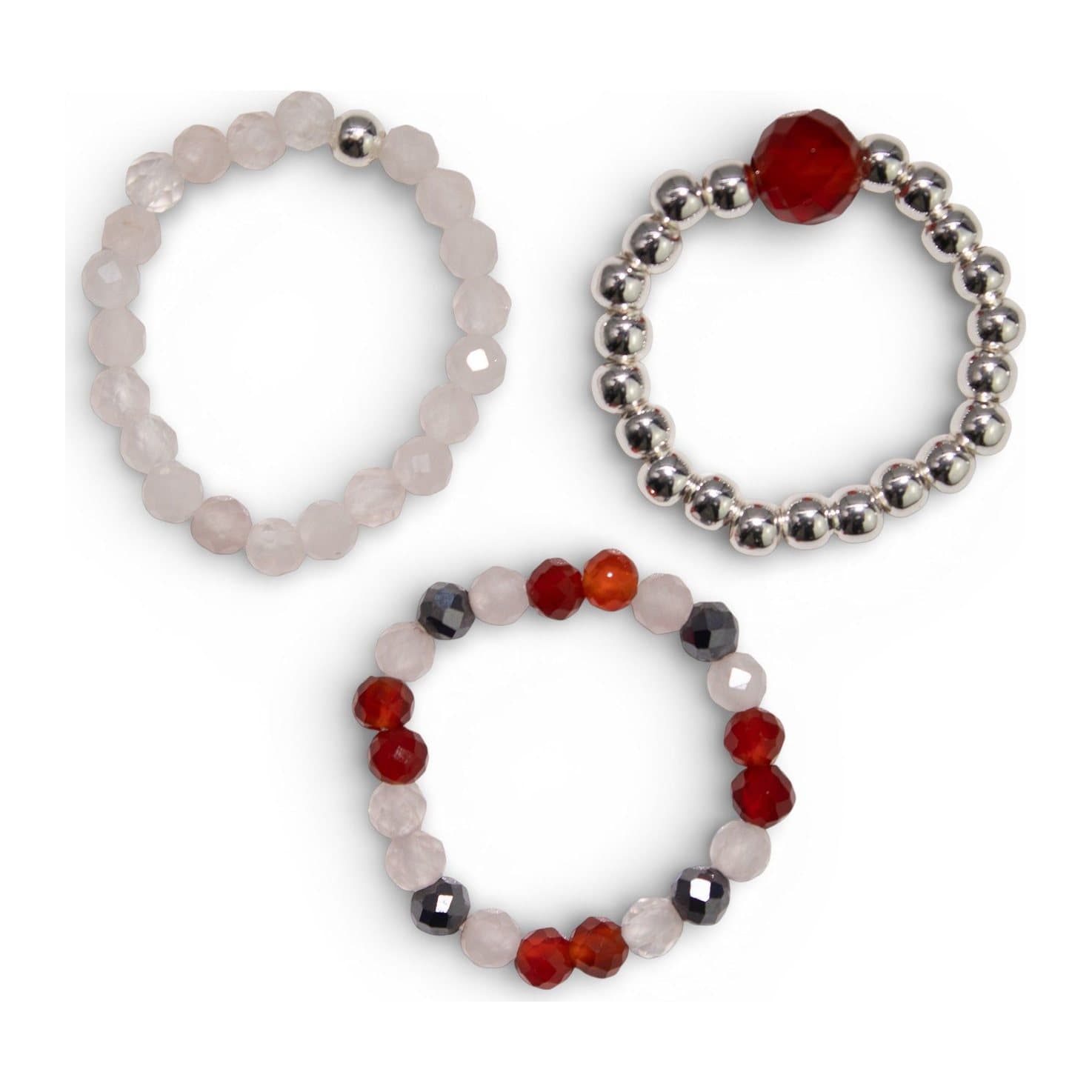 Set of three elasticated gemstone rings with rose quartz, ruby and silver-tone beads